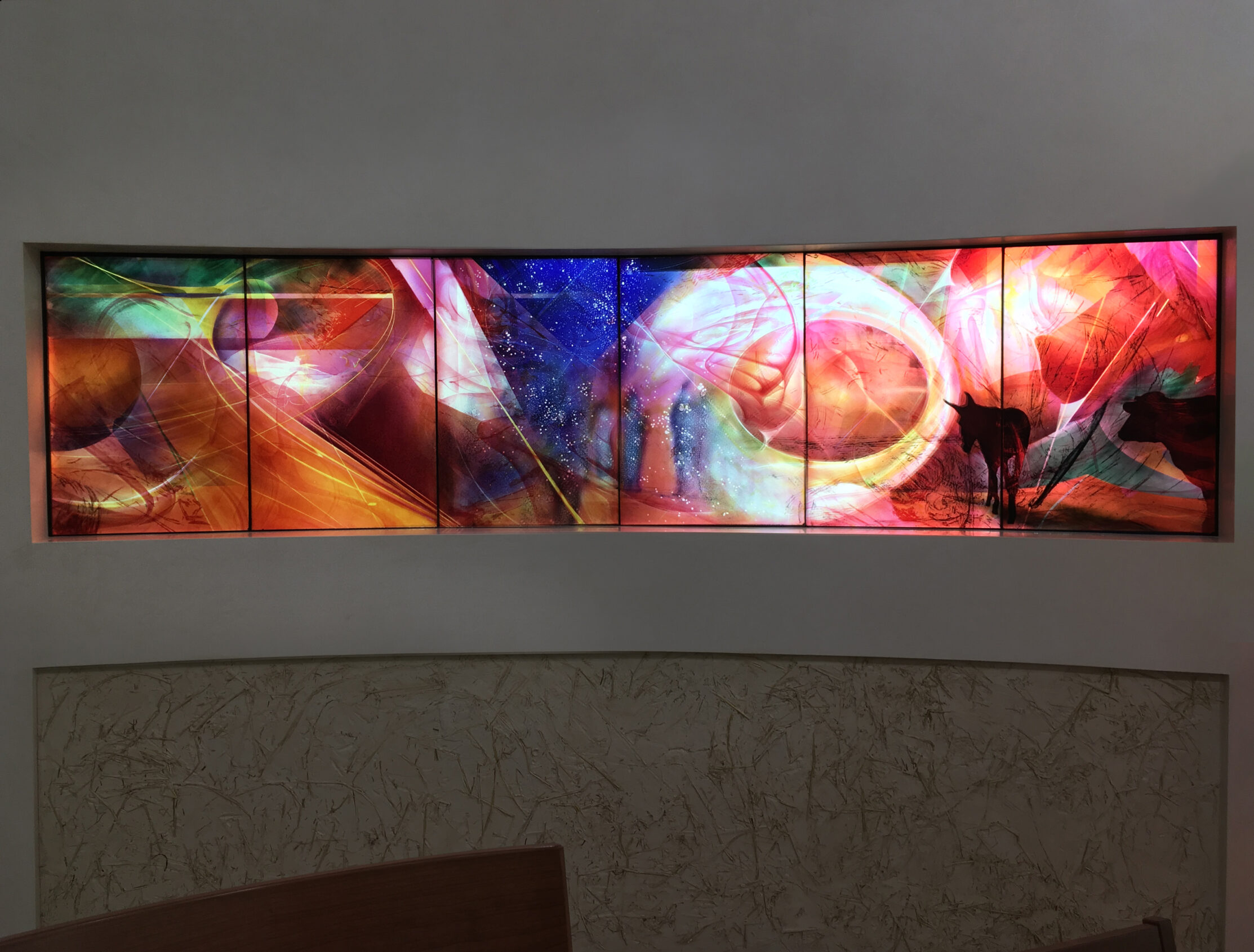 The Reredos glazing elements reflecting cosmological movement and return in the story of the El Greccio Nativity stained glass.