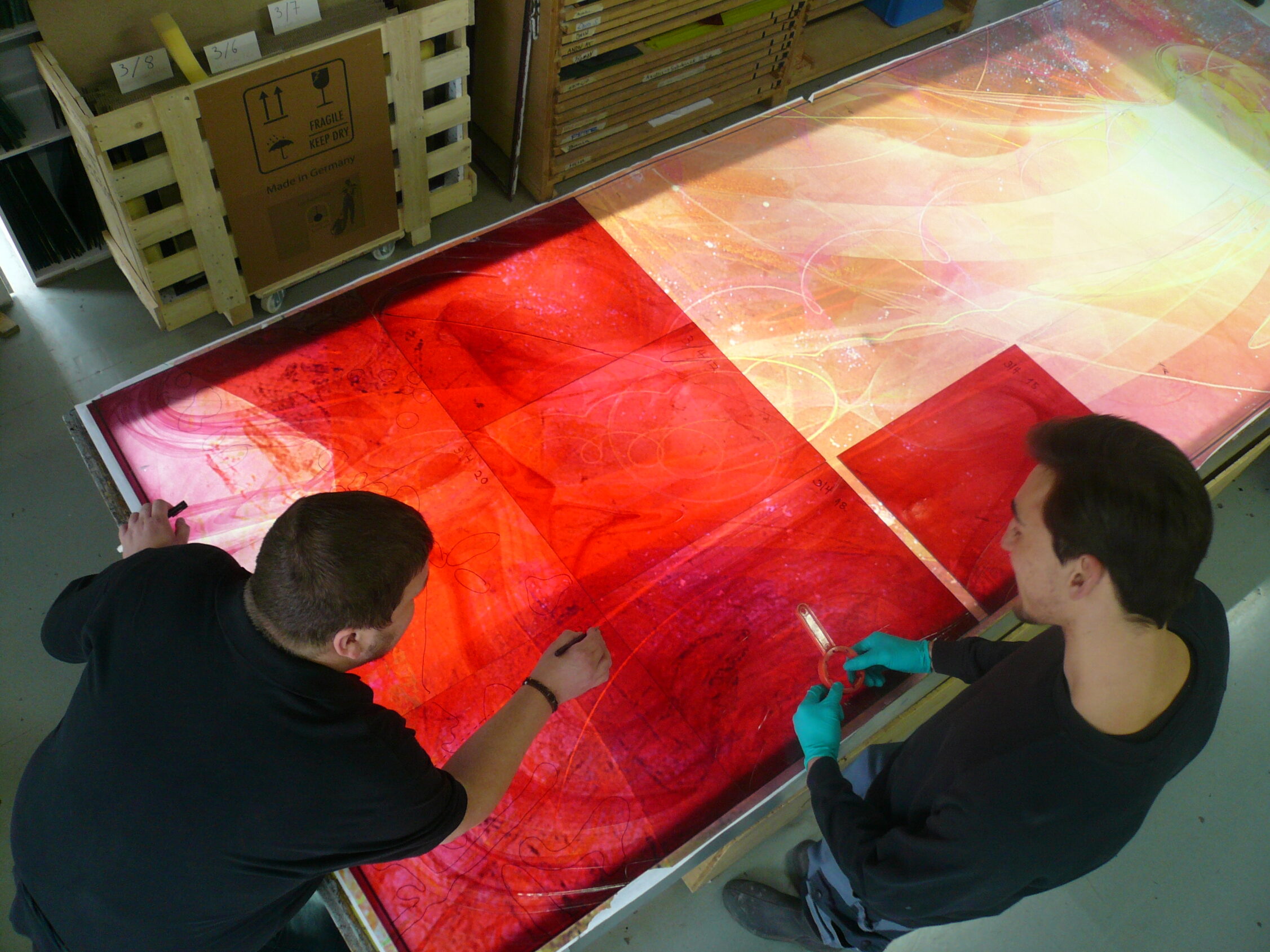 Olaf and Roman discussing the glass painting sequence for Our Lady of the Angel Marian window