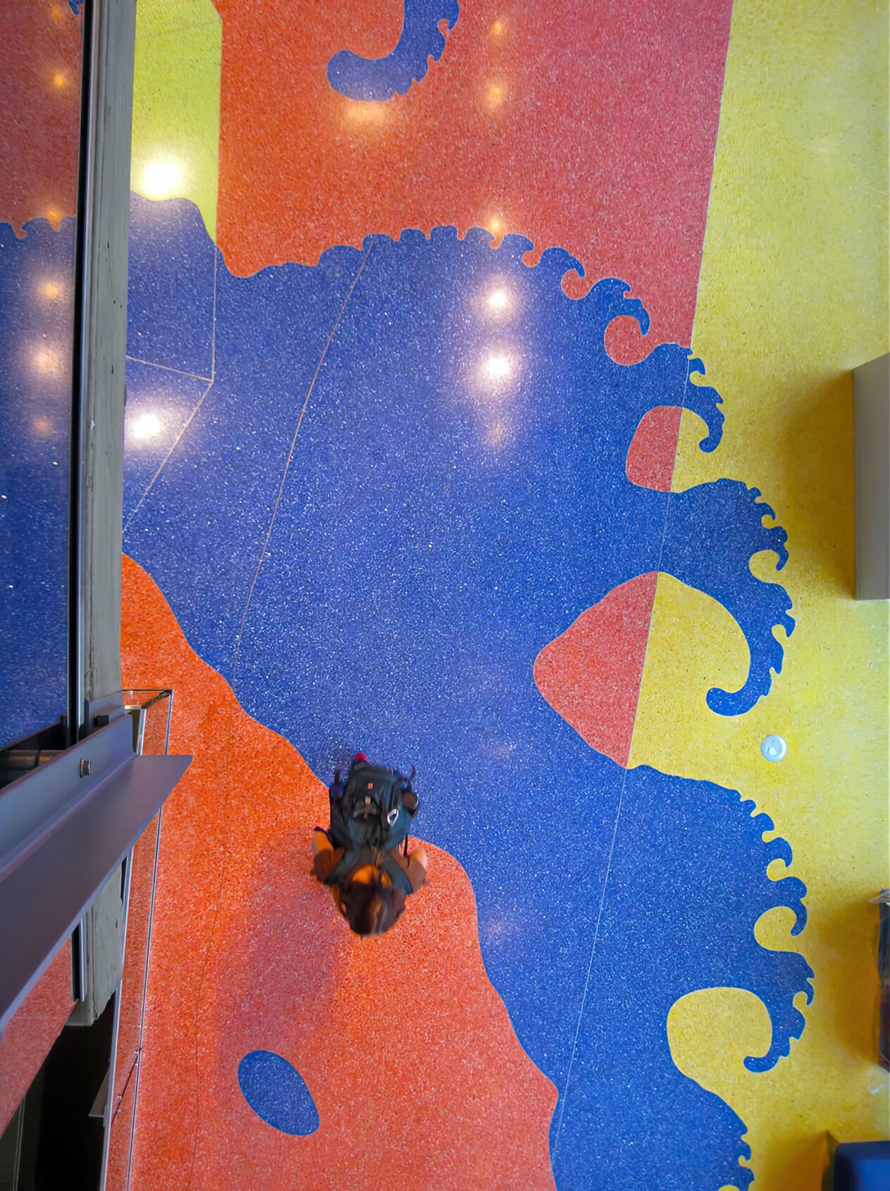 Looking down on an epoxy terrazzo fractal shape in the floor