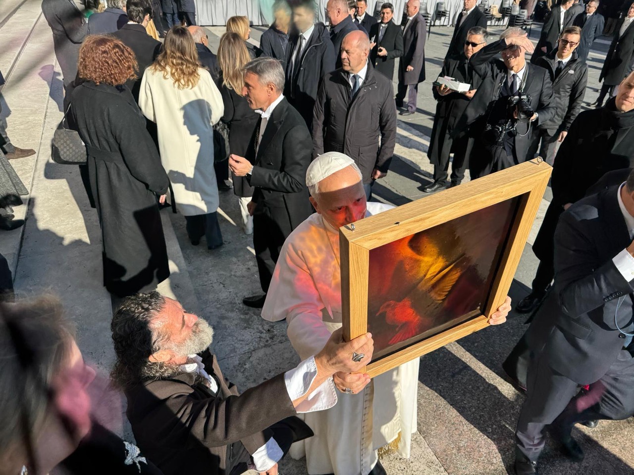 Yvelle Gabriel presenting his glass to the Pope on December 9, 2025