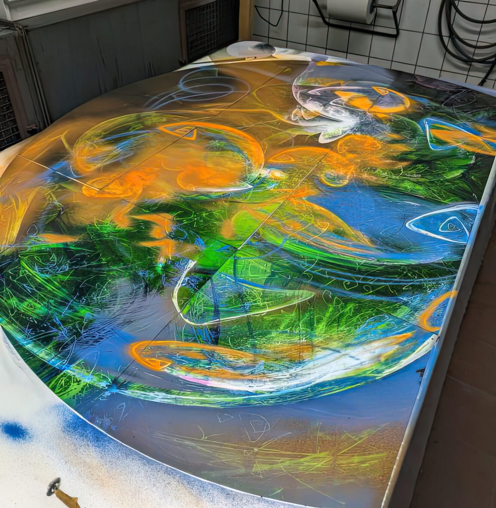 Spraybooth with the Holy Trinity Rose Window in progress at Derix Glasstudios