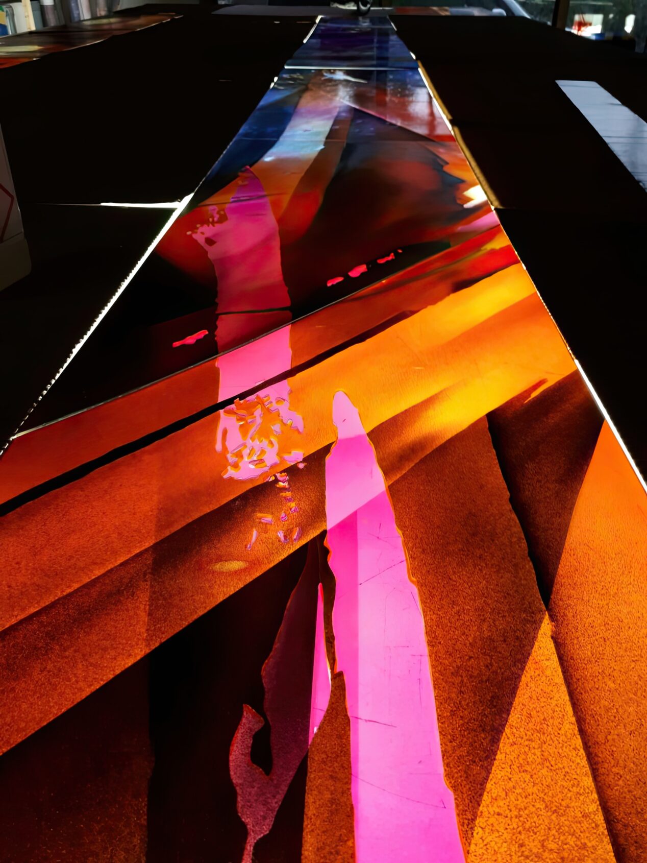 The glass tower torch window in progress on the light table at Derix Glasstudios