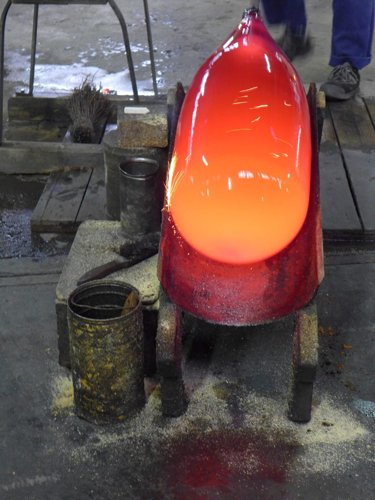 Blowing glass with the gather in the marver trough