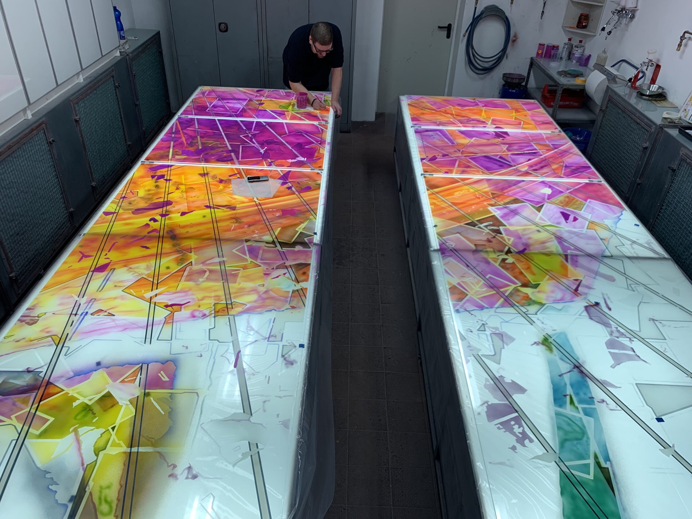 Olaf working on two panels in the spray booth for the Aurora project