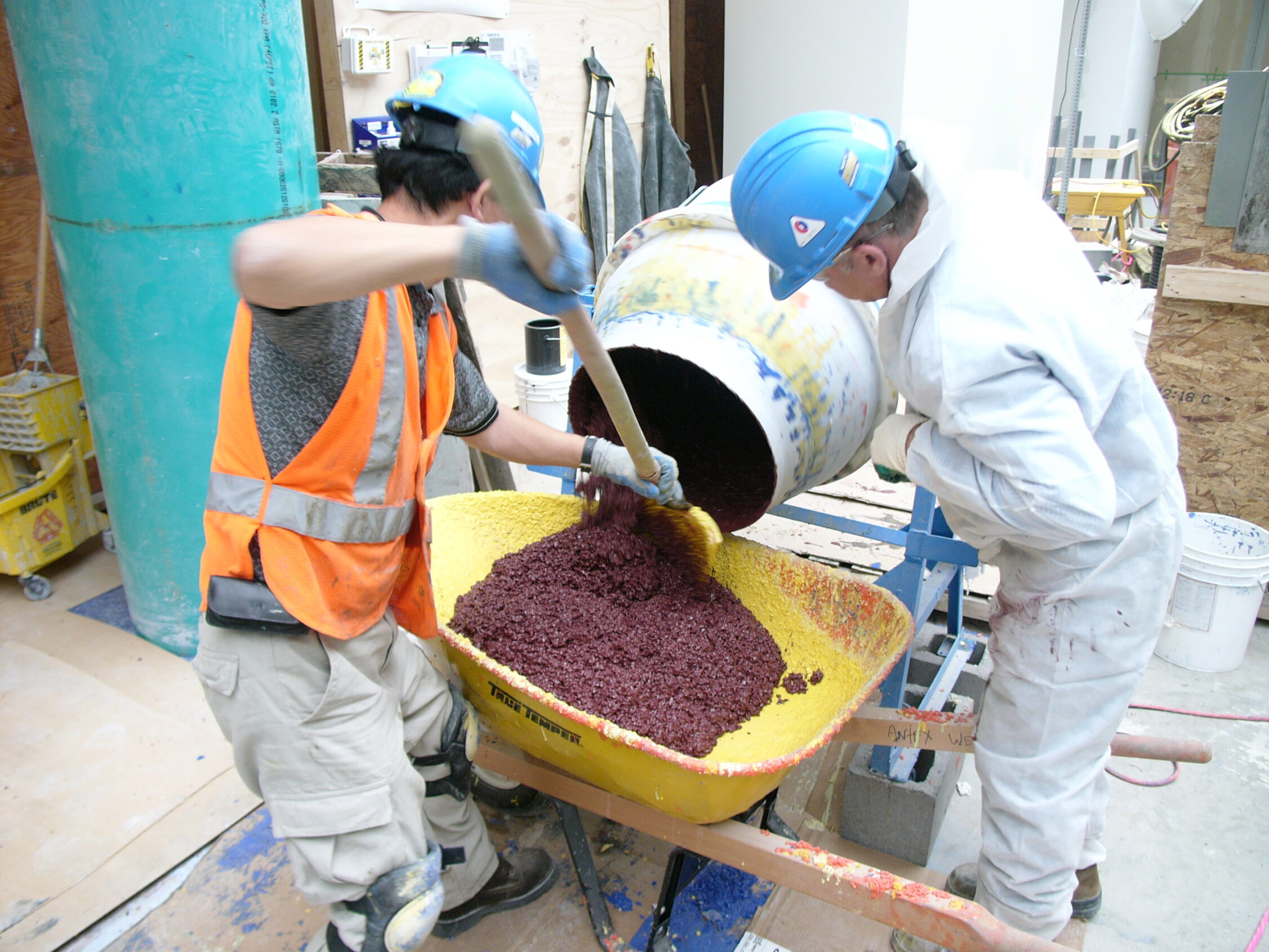 Mixing the aggregates recipe mix with the epoxy terrazzo prior to troweling at the Centennial Centre for Interdisciplinary Sciences